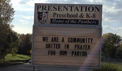 The sign at Presentation of the Blessed Virgin Mary church and school in Maplewood. (Pioneer Press: Emily Gurnon)