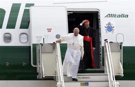 Pope Francis (L) and Cardinal Tarcisio Bertone step off a plane after returning from their trip to Brazil at Ciampino airport, south of Rome, July 29, 2013.