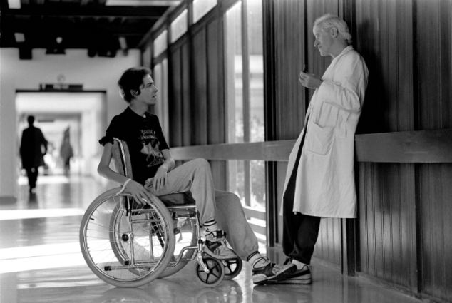 'I run this hospital': Savile, speaking to a patient at Stoke Mandeville Hospital in 1990, was interviewed under caution by police two years before his death (file picture)
