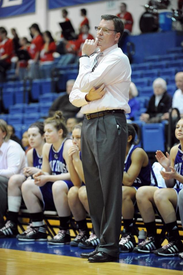 Bill Gibbons, longtime women’s basketball coach at College of the Holy Cross, is on administrative leave after being sued by a former player.