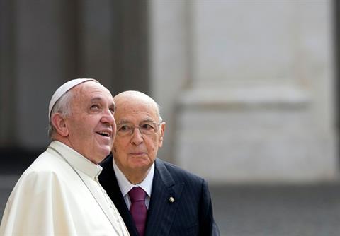 Italian President Giorgio Napolitano, right, stands next to Pope Francis as he looks up at the Vatican flag waving on the top of the Quirinale Presidential Palace on the occasion of their meeting in Rome, Thursday, Nov. 14, 2013. (AP Photo/Alessandra Tarantino)