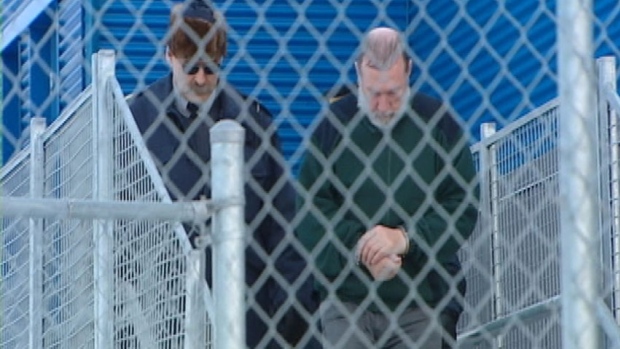 Eric Dejaeger is escorted outside the Iqaluit courthouse in January 2011. On Monday, he pleaded guilty to eight sex-related charges involving children.