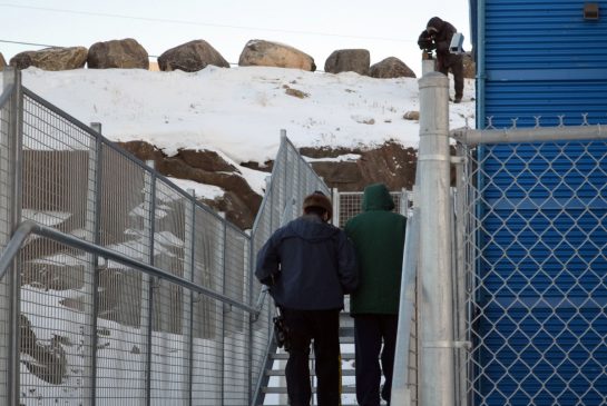 Eric Dejaeger is escorted into court in Iqaluit, Nunavut.