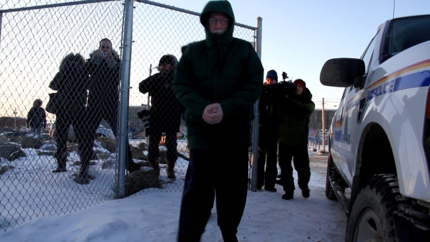 Eric Dejaeger is escorted outside the Nunavut Court of Justice in Iqaluit Monday, November 18, 2013. Dejaeger's defence lawyer says the memory and credibility of alleged victims about events 30 years ago are key to his defence. (Vincent Desrosiers/CBC)
