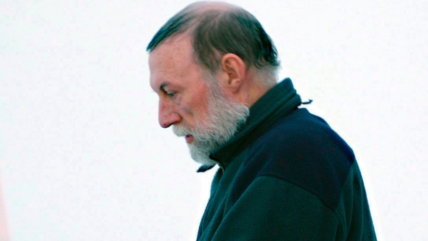 Catholic priest Eric Dejaeger leaves an Iqaluit, Nunavut courtroom Jan. 20, 2011 after his first appearance for six child sexual abuse charges in Igloolik dating back to the 1970s. (Chris Windeyer / THE CANADIAN PRESS)