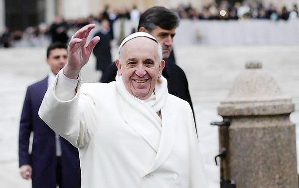 Pope Francis waves as he conducts his weekly general audience at St. Peter's Square at the Vatican (Max Rossi Reuters, / November 27, 2013)