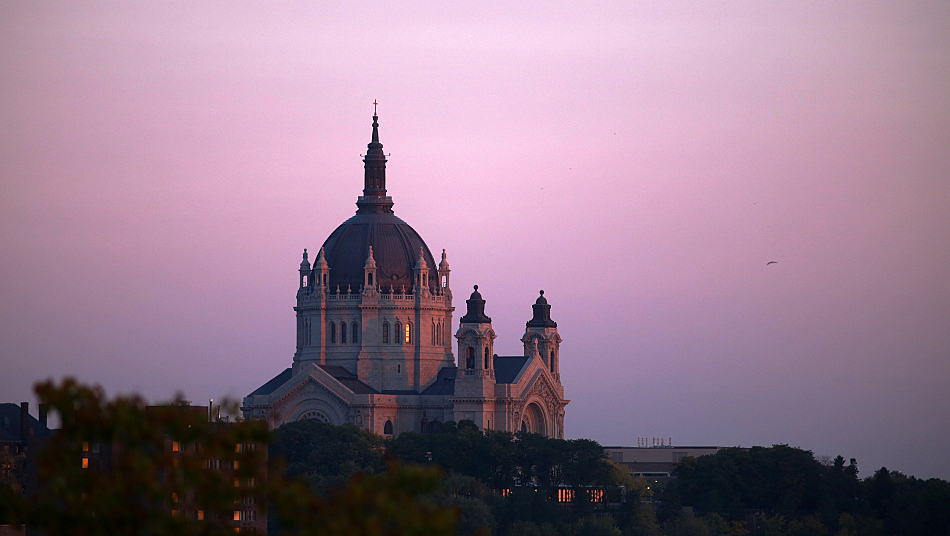 The Cathedral of St. Paul, seat of the Archdiocese of St. Paul and Minneapolis, cuts a stark silhouette against the St. Paul skyline. Archdiocesan leaders released the names of priests Thursday who it said have had "substantiated claims" of sexually abusing children leveled against them. Seven of the priests named in today's release were not previously known by the public as abusers. (Jeffrey Thompson/MPR News)