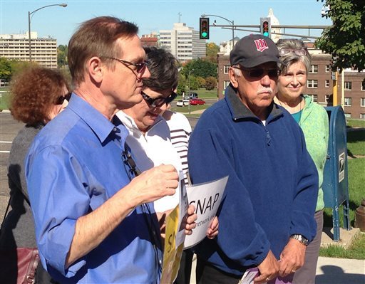 FILE - In this Oct. 7, 2013 file photo, David Clohessy, left, national director of the Survivors Network of those Abused by Priests (SNAP), left, is joined by Frank Meuers, Plymouth, Minn. outside the Archdiocese Chancery in St. Paul, Minn. Meuers came forward and for the first time publicly told how he was abused by a priest, Rudolph Henrich, while a youngster in Golden Valley. The Archdiocese of St. Paul and Minneapolis sent an email to priests and parish leaders Wednesday, Dec. 4, bracing them for its upcoming disclosure of the names of more than two dozen clergy who have been credibly accused of sexually abusing minors. (AP Photo/The St. Paul Pioneer Press, Emily Gurnon,File) MINNEAPOLIS STAR TRIBUNE OUT