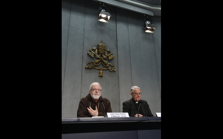 Boston Cardinal Sean O'Malley, a member of Pope Francis' advisory Council of Cardinals, speaks during a press conference Thursday at the Vatican. At the press conference, O'Malley announced that Pope Francis accepted a proposal from the council to establish a special commission on the sexual abuse of children. At right is Jesuit Fr. Frederico Lombardi, the Vatican spokesman. (CNS/Paul Haring)