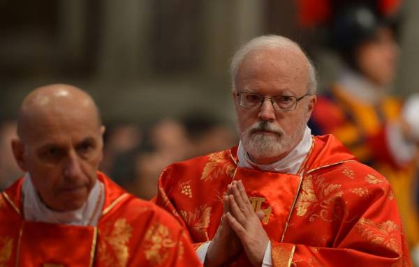 US cardinal Sean patrick O'Malley prays during a grand mass in St Peter's Basilica ahead of a papal election conclave on March 12, 2013 in St Peter's basilica at the Vatican. O'Malley announced a committee to probe child abuse set up by Pope Francis. Picture: AFP/GABRIEL BOUYS