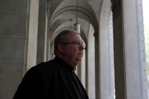 Monsignor William Lynn walks to the Criminal Justice Center in Philadelphia in 2012.