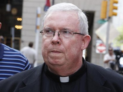 Monsignor William Lynn walks from the courthouse after the jury finished deliberating for the day in his sexual abuse trial in Philadelphia,