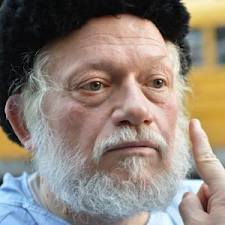 Rabbi Nuchem Rosenberg in hospital gown