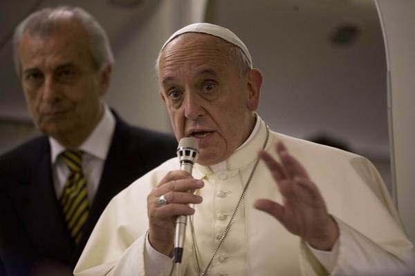 Pope Francis talks to reporters aboard the papal flight on his way back to the Vatican from Jerusalem May 26, 2014. Pope Francis navigated the minefield of the Israeli-Palestinian conflict and humbly bowed to kiss the hands of Holocaust survivors on Monday, the last day of a Mideast trip laden with bold personal gestures. (Andrew Medichini / REUTERS / May 26, 2014)