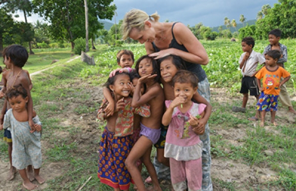 Stephanie Henry visits with children at the Sao Sary Foundation in Cambodia in 2013. The foundation identifies girls who are at high risk for human trafficking and provides sustainable assistance to them and their families.
