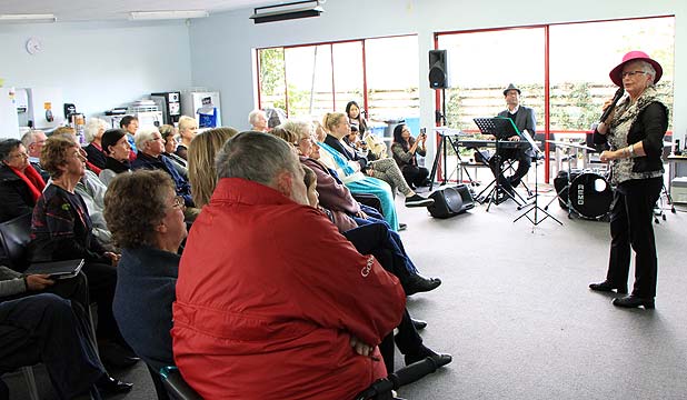 SING-A-LONG: Pauline singing to the audience of Pinehurst teachers and their parents, who joined in.