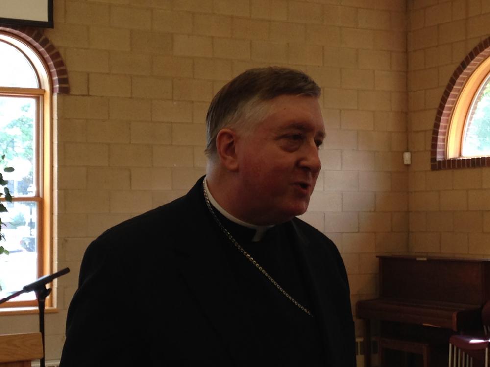 Incoming Bishop Mitchell Rozanski before a press conference in Springfield.