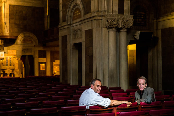 Paul Elie, right, and Dave Isay at St. Bartholomew’s Episcopal Church in Manhattan. They are working on an oral history project.
