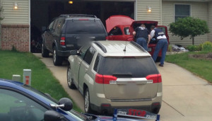 Police raid the Caledonia home of John Balyo following his arrest. (June 20, 2014)