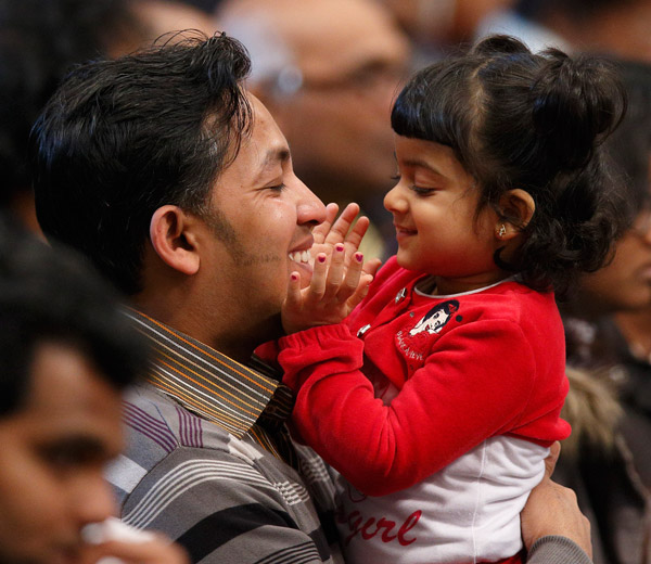 Family members from Sri Lanka attend a Mass in St. Peter's Basilica at the Vatican in February. The new working document for this October's extraordinary Synod of Bishops at the Vatican deals with some of the most contested and controversial areas of Catholic moral teaching on the family. (CNS/Paul Haring)