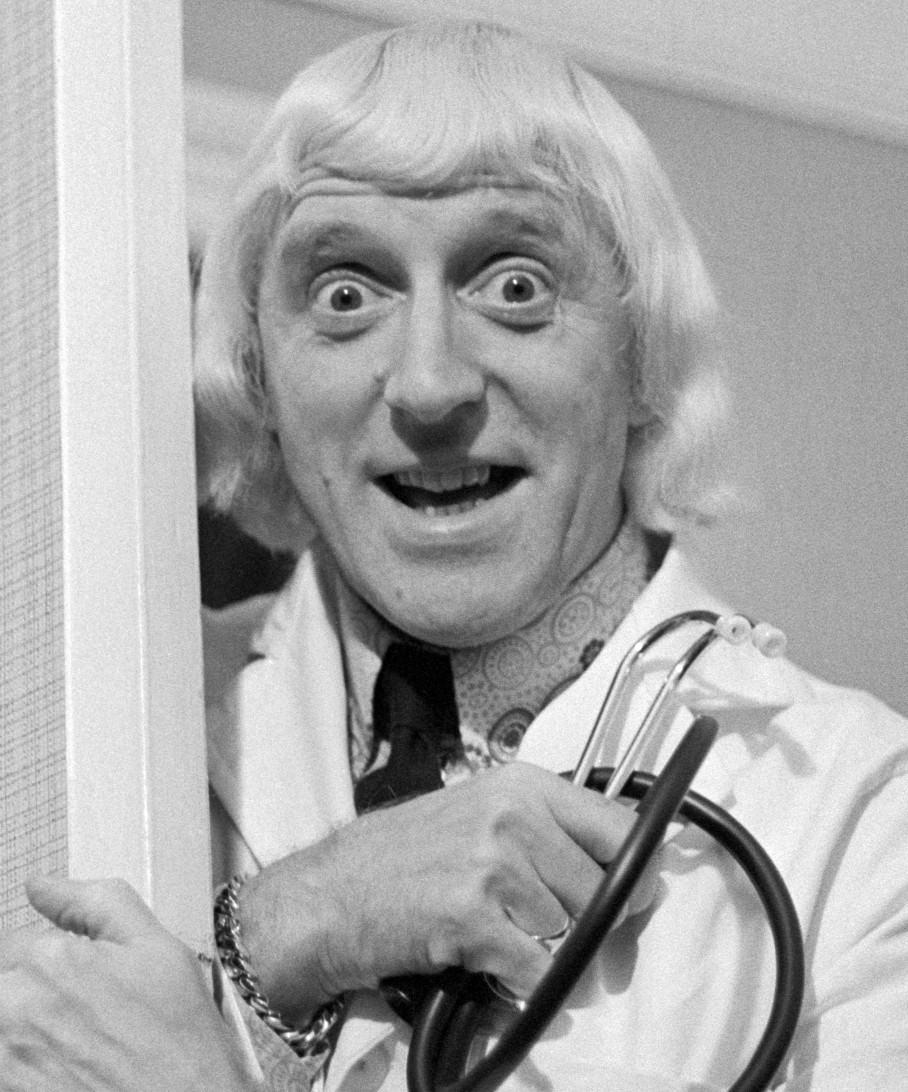 Jimmy Savile visiting the patients and staff of Leeds General Infirmary in Leeds, England, in 1972. (AP/PA)