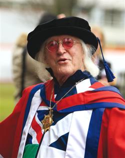 Jimmy Savile getting a honoary doctor of arts degree at Bedfordshire University
