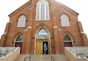 Garry Salois pauses recently at the entrance of the St. Ignatius mission. For Salois, who is Salish-Cree and French, the church reminds him of the physical and sexual abuse he suffered as a young boy at the hands of Jesuit priests or Jesuit-supervised nuns. TOM BAUER/Missoulian
