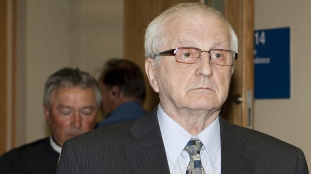Rev. Raymond-Marie Lavoie walks outside for a lunch break at his trial in Quebec City, Monday, July 11, 2011. Lavoie is one of the defendants in the class-action suit. He was sentenced to three years in prison for abusing students at the St. Alphonse Seminary. (THE CANADIAN PRESS/Jacques Boissinot)