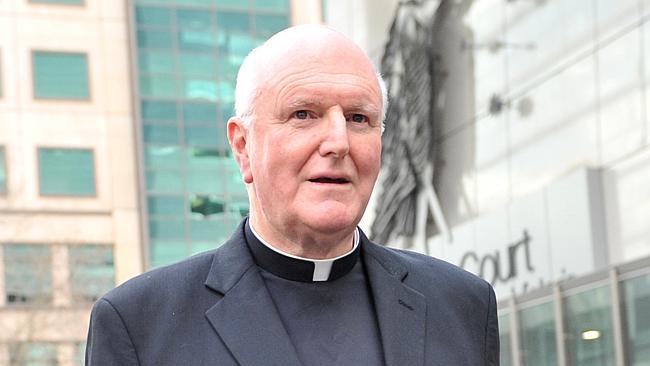 Archbishop Denis Hart leaves the County Court in Melbourne after giving evidence at the royal commission into child sexual abuse.