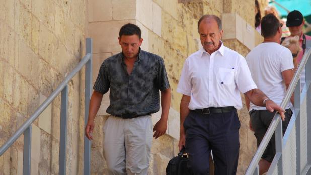 Fr Jesmond Gauci (left) seen with his defence lawyer.