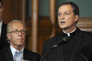 Charles Lachowitzer, vicar general of the Archdiocese of St. Paul and Minneapolis, speaks during a news conference in St. Paul on Monday, Oct. 13, 2014, as attorney Jeff Anderson, left, listens. (Pioneer Press: Scott Takushi)
