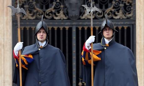 Swiss Guards attend the pope's weekly audience in St Peter's Square.