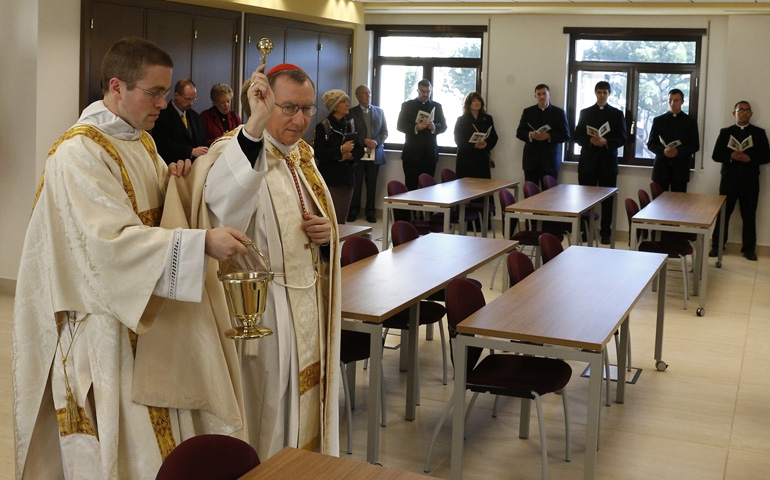 Cardinal Pietro Parolin blesses a classroom during the dedication Tuesday of a new building at the Pontifical North American College in Rome. (CNS/Paul Haring)