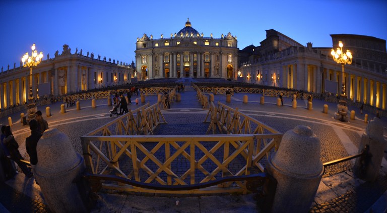 A picture shows St Peter's square and the basilica during sunset on March 29, 2014 at the Vatican. Andreas Solaro/AFP