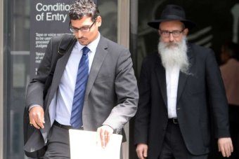 PHOTO: Zephaniah Waks (right) with his son Manny in December 2013. (AAP: Mal Fairclough, file photo)