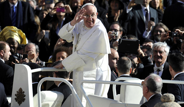 Pope Francis waves to the crowd from the papamobile during his inauguration mass at St Peter's square in 2013 at the Vatican. TNS file photo