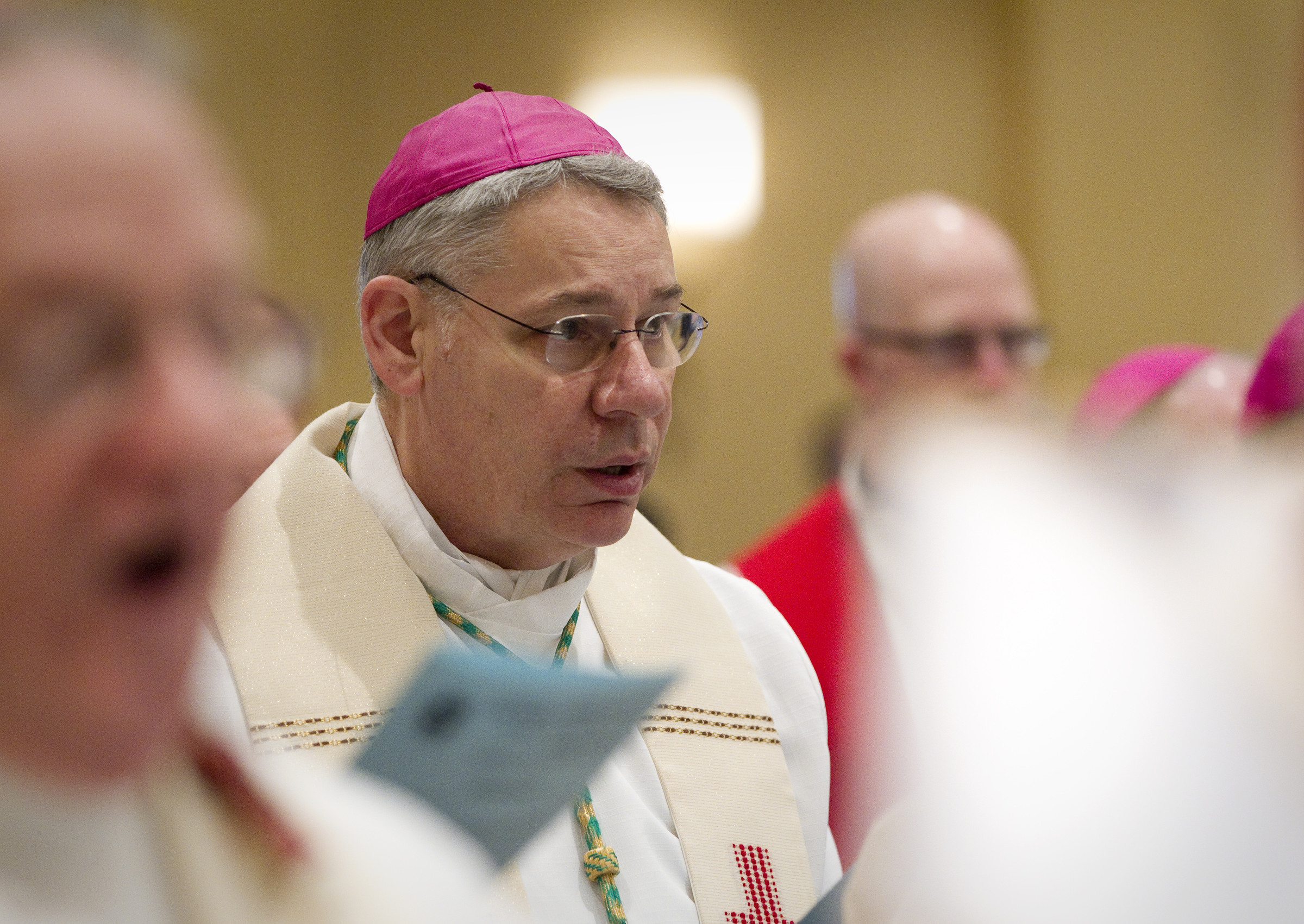 Bishop Robert W. Finn of Kansas City-St. Joseph, Mo., sings during Mass in this Nov. 12, 2012 file photo. (CNS photo/Nancy Phelan Wiechec)