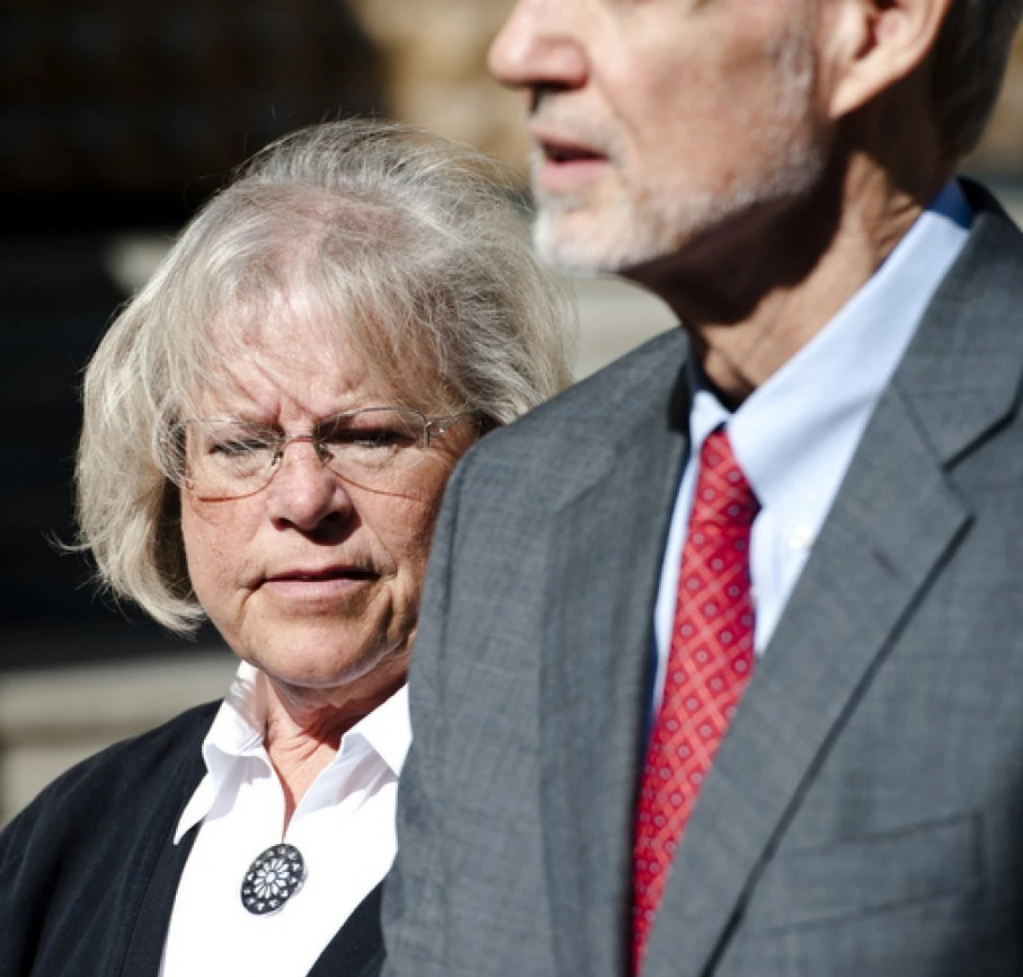 FILE: Heather Cook, the Episcopal bishop charged with driving under the influence and fatally striking a bicyclist in December, stands with her attorney, David T. Irwin, outside the Clarence Mitchell Courthouse on April 2, 2015. (Photo by Christopher T. Assaf/Baltimore Sun staff)