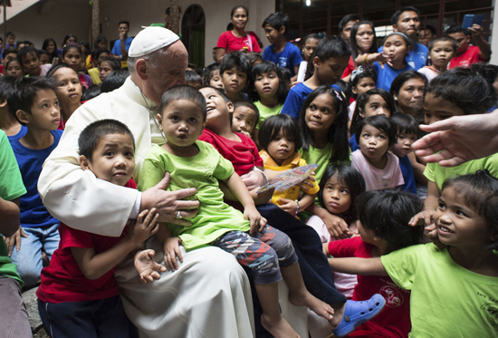 When Pope Francis visited the Philippines he visited an orphanage and heard stories of rescued street children. Photo: CNS