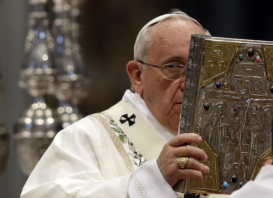 FILE - In this Thursday, April 2, 2105 file photo, Pope Francis Pope holds the book of Gospels as he presides over Chrism Mass in St. Peter's Basilica, at the Vatican. When Pope Francis visits the United States this fall, he can expect the same rock-star adulation that greets him wherever he goes. But his positions on hot-button issues such as the death penalty and climate change could quickly set the stage for conflict. That may explain why Francis has been clearing the decks on a host of less high-profile matters of contention that could also have marred the visit.