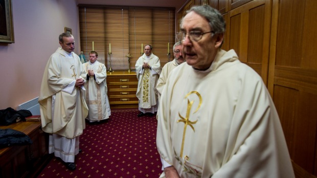 Corpus Christi College priests prepare for the morning mass. Photo: Justin McManus