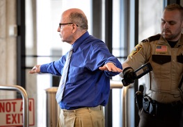 Francis Hoefgen, shown passing through a security checkpoint at the Dakota County Judicial Center on Wednesday, was a