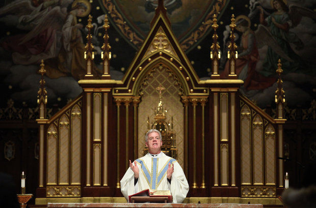Rev. Warren Hall claimed last week that he was fired as director of campus ministry at Seton Hall University over a pro-LGBT social media post. Here, Hall leads a special mass for couples renewing their vows on Valentine’s Day 2014 at the Chapel of the Immaculate Conception on the university's South Orange campus. (Frances Micklow/The Star-Ledger) (Frances Micklow/The Star-Ledger)