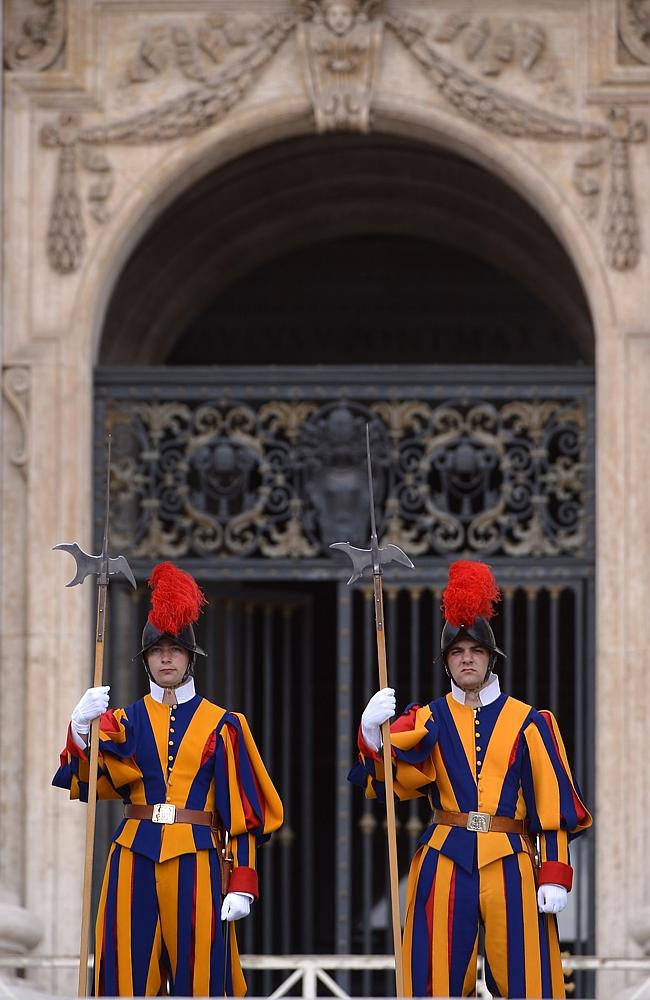 Defensive stance ... Swiss guards stand in St Peter's square. The Vatican has said it will punish any member of the clergy found guilty under the Royal Commission into Institutional Responses to Child Sex Abuse. Source: AFP Source: AFP