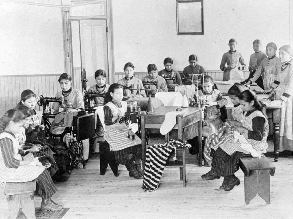 Dene children at work in this undated shot from the Catholic-run residential school at Fort Resolution, Northwest Territories. The academic quality in most of the schools was very low.