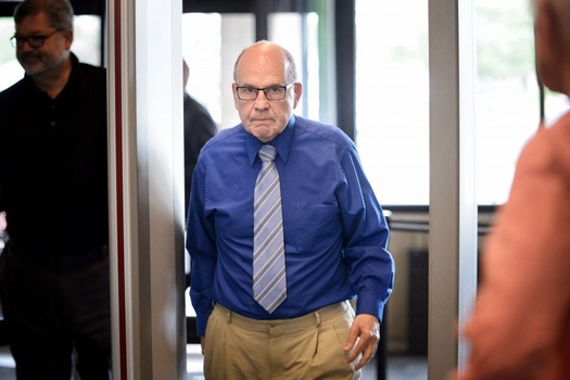 Former priest Francis Hoefgen passed through security at the Dakota County Judicial Center in Hastings on May 20.