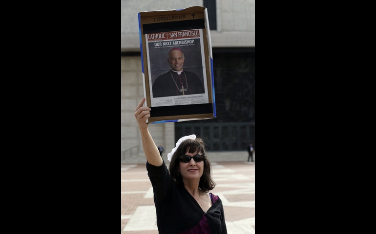 Clare Polansky holds a sign in support of Salvatore Cordileone during his installation as the new archbishop of San Francisco at the Cathedral of St. Mary of the Assumption Oct. 4, 2012. (AP Photo/Pool/Marcio Jose Sanchez)