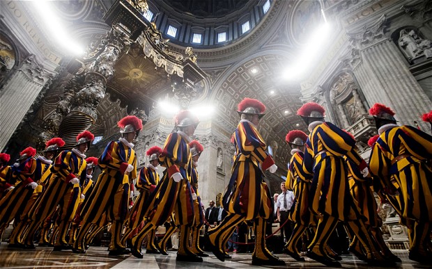 New papal Swiss guards in their ceremonial uniforms arrive for a mass celebrated by Vatican State Secretary cardinal Pietro Parolin in Saint Peter's Basilica. Photo: Angelom Carconi/EPA