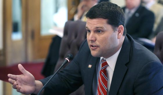 In this file photo taken Feb. 5, 2015, Arkansas State Sen. Bart Hester, R-Cave Springs, presents a bill to the a Senate at the Arkansas state Capitol in Little Rock, Ark., to prevent local governments from passing their own anti-discrimination ... more >
