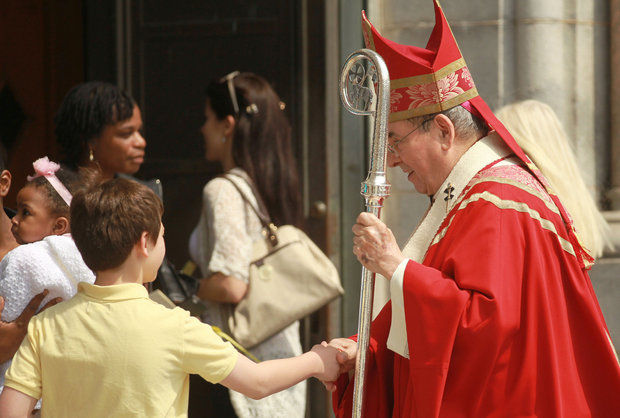 Archbishop John Myers greets parishioners on the steps of the Cathedral Basilica of the Sacred Heart following Palm Sunday mass 2014. (John Munson/NJ Advance Media)